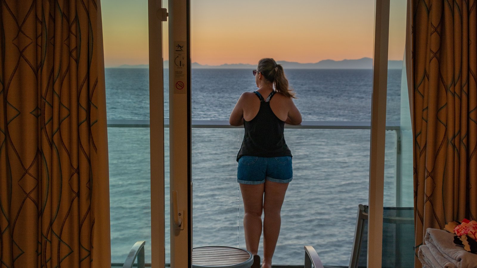 Solo traveler on a cabin balcony