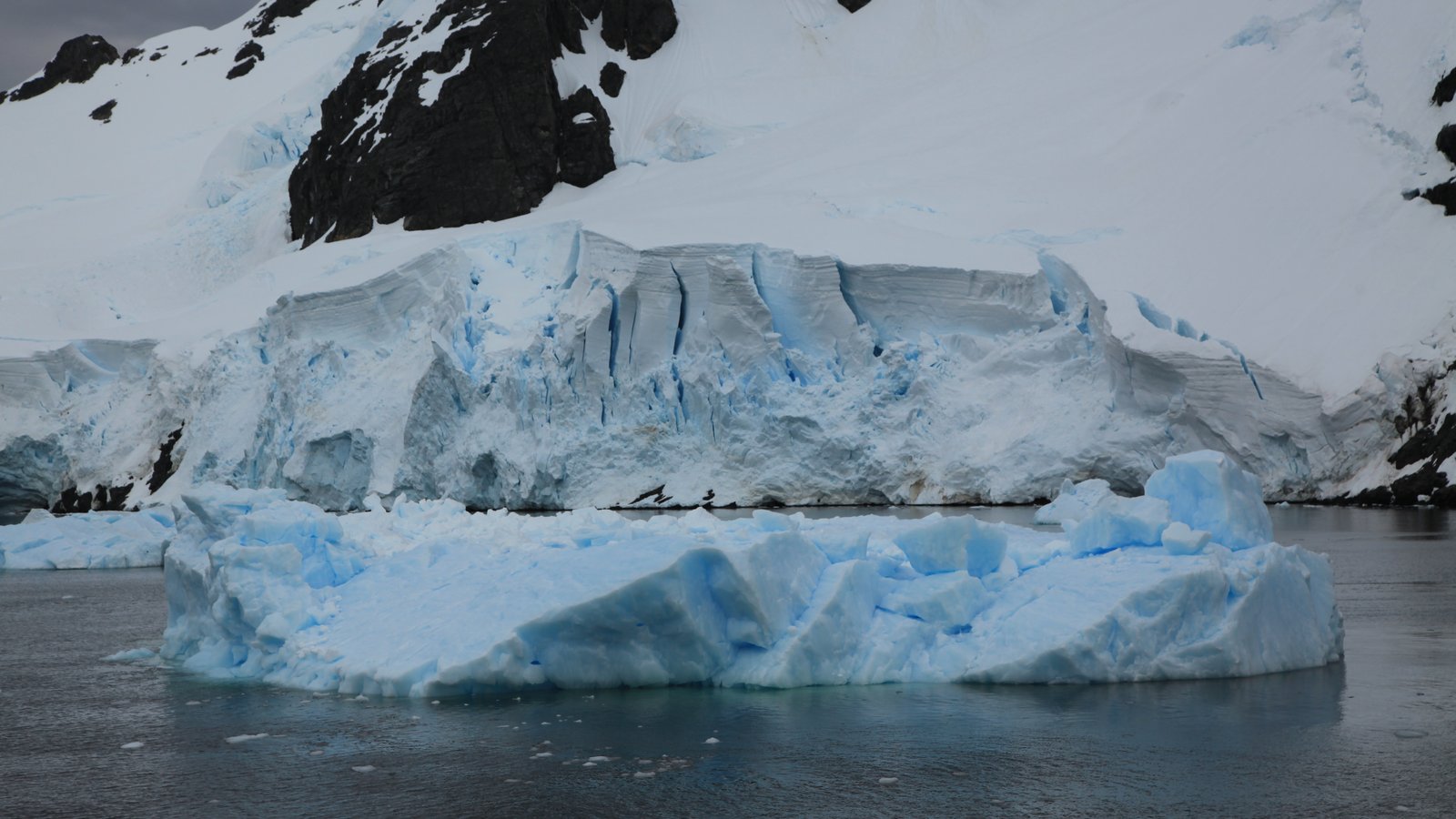 Iceberg and glacier in the Lemaire Channel, Antarctica