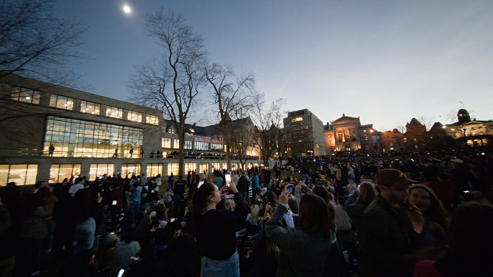 Crowd watching totality of solar eclipse at McGill University, April 2024